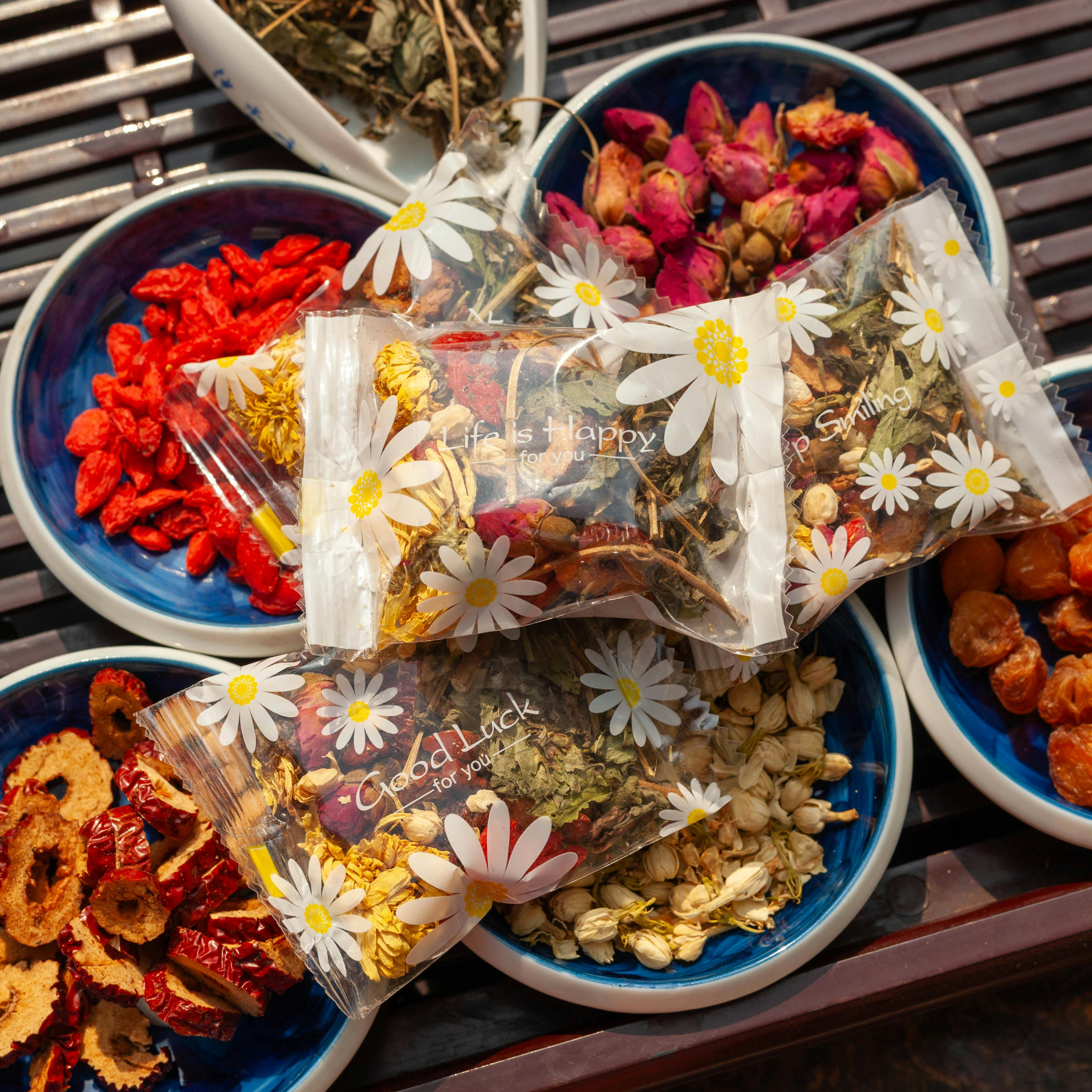 pexels-photo-29387166-29387166 Vibrant collection of herbal teas and dried fruits in decorative bowls. Ideal for tea enthusiasts.